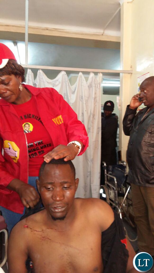 Sylvia Masebo at the hospital with one of the injured UPND supporters