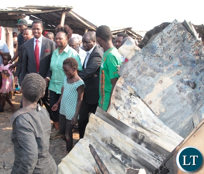 President Edgar Lungu and Lusaka Central MP Margaret Mwanakatwe inspects the burnt down shops at Bauleni Market