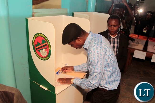 President Edgar Lungu in both max his ballot paper during in Chawama Constituency at Apostalic Faith Church