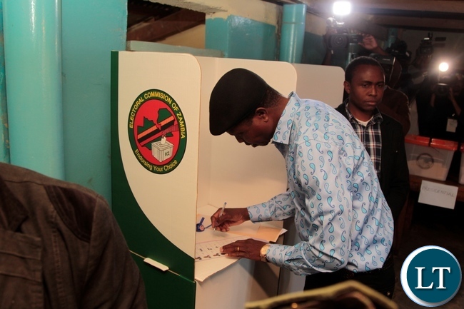 President Edgar Lungu in both max his ballot paper during in Chawama Constituency at Apostalic Faith Church