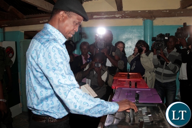 President Edgar Lungu casting his ballot paper in Chawama Constituency at Apostolic Faith Church