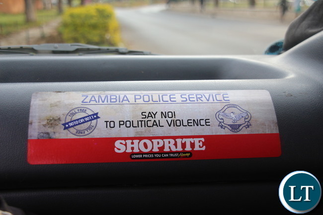 Zambia Police stickers and billboard sensitising people not to resolve to violence motivated by politic sentiments. Courtesy of Jean Mandela