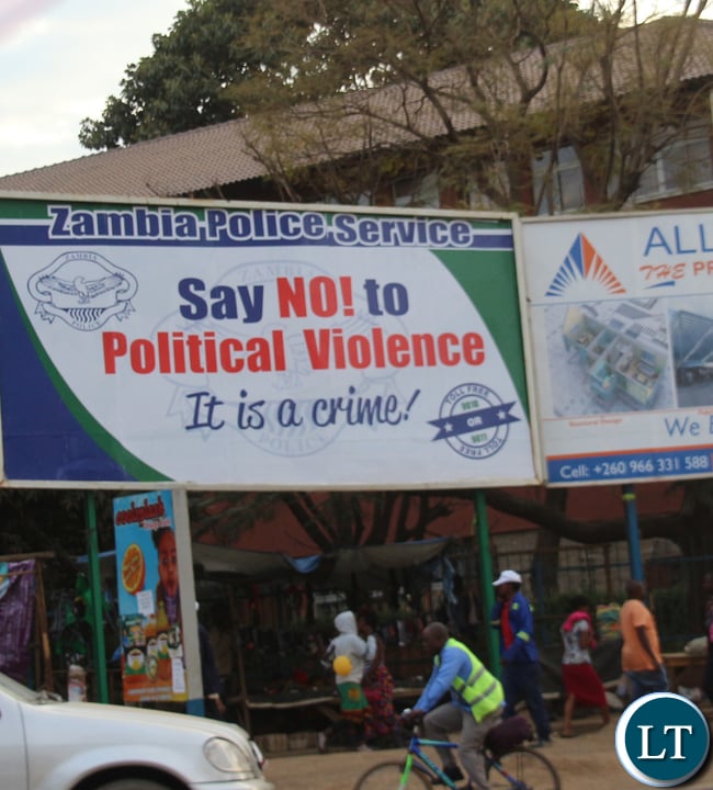 Zambia Police stickers and billboard sensitising people not to resolve to violence motivated by politic sentiments. Courtesy of Jean Mandela