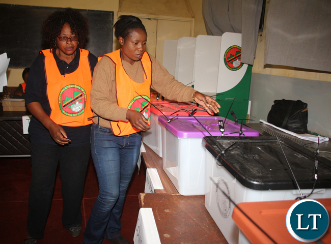 Kamwala Home Craft Center Polling Station Presiding Officer Beatrice Mulevu inspecting the ballots before the starting of voting. Kamwala Home Craft Center Polling Station Presiding Officer Beatrice Mulevu inspecting the ballots before the starting of voting.