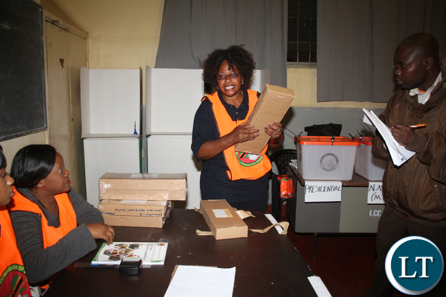 Kamwala Home Craft Center Polling Station Presiding Officer Beatrice Mulevu inspecting the ballots before the starting of voting.