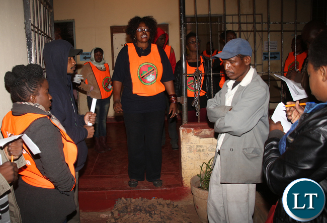 Kamwala Home- Craft Center Polling Station Presiding Officer Beatrice Mulevu ceremoniously declaring the opening of the polling station.
