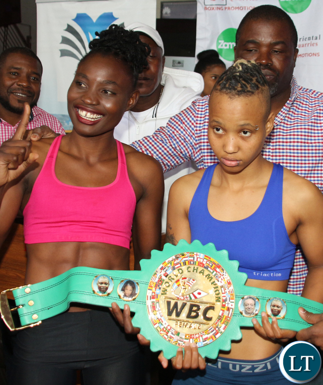 WBC Bantamweight Champion Catherine Phiri with the title challenger south African boxer Gibisile Tsabala during the weigh in at Chicago Restaurant at Manda Hill in Lusaka