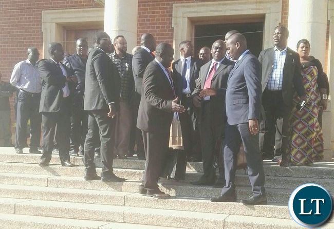 Lawyers shaking hands outside the Supreme Court