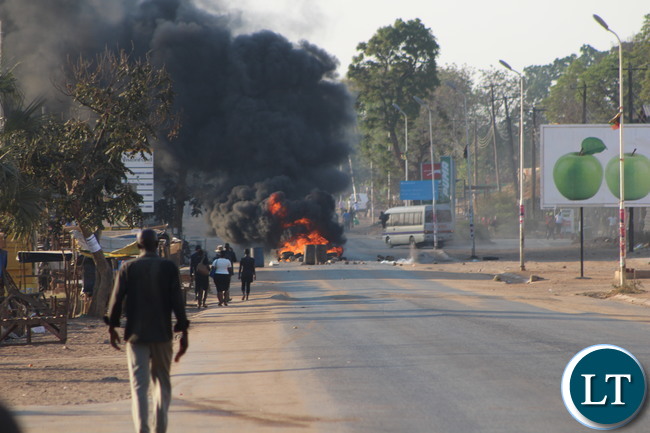 Plumes of smoke from burning tyres placed by United Party for National Development (UPND) supporters on the Monze-Lusaka road during the protest by the cadres after the announcement of the Edgar Lungu as president-elect yesterday. The cadres engaged in a running battle with police which lasted for several hours till late last night. Plumes of smoke from burning tyres placed by United Party for National Development (UPND) supporters on the Monze-Lusaka road during the protest by the cadres after the announcement of the Edgar Lungu as president-elect. The cadres engaged in a running battle with police which lasted for several hours till late last night.