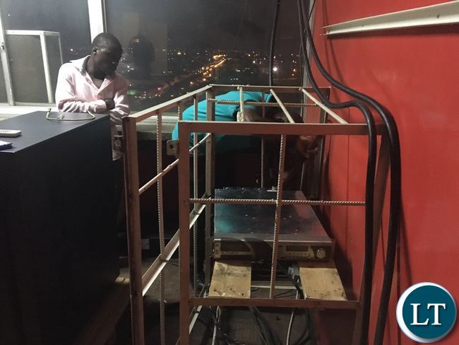 ZICTA officials switching off Komboni transmitters at Indeco House last night