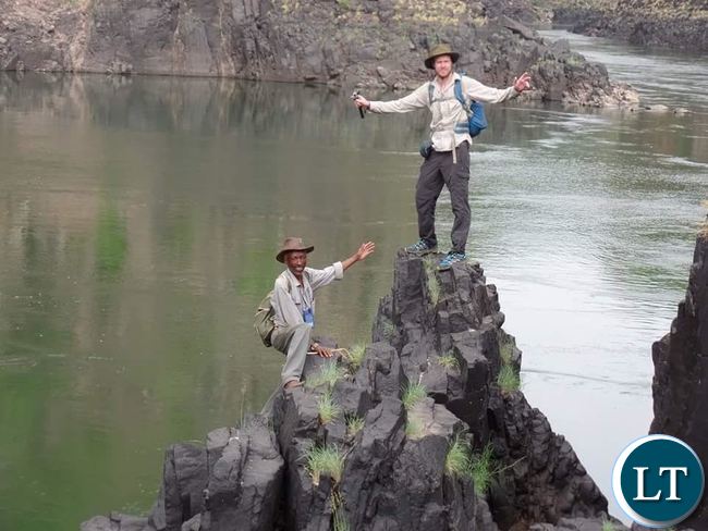 Livingstone based retired medical doctor Teddy Mulenga (left) and British National Chaz Powell (right) pose for a picture on Zambezi River in readiness for their long journey from the source of Zambezi River in Northern Western Province of Zambia to Mozambique