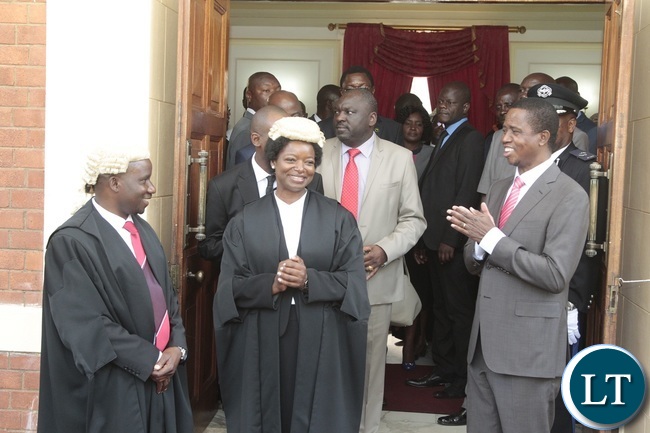 President Edgar Lungu chats with Newly appointed First Speaker of the National Assembly Catherine Namugala (2nl) and second Speaker of the National Assembly Mwemba Malama (l) shortly after swearing in Ceremony at State House President Edgar Lungu chats with Newly appointed First Speaker of the National Assembly Catherine Namugala (2nl) and second Speaker of the National Assembly Mwemba Malama (l) shortly after swearing in Ceremony at State House