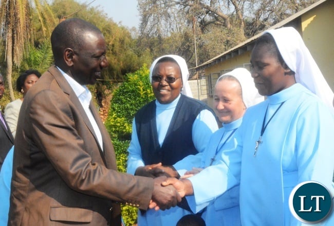 Kenyan Vice President William Ruto(l) being welcomed by sister Sarah Kanyembo(r) during his visit to the Ophanage