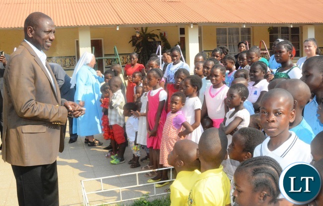 Kenyan Vice President William Ruto greets the Children of Kasisi Ophanage during his visit to the Ophanage