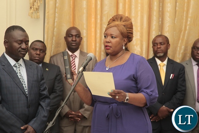 Newly appointed Minister of Agriculture Dora Siliya taking Oath before President Edgar Lungu during swearing in ceremony at State House