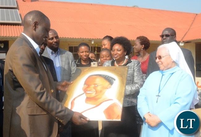 Kenyan Vice President William Ruto(r) admiring the drawing which was given to him by the Kasisi Ophanage Children while the Sister in Charge Mariola Mierrejewska(l) looks on during his visit to the Ophanage Kenyan Vice President William Ruto(r) admiring the drawing which was given to him by the Kasisi Ophanage Children while the Sister in Charge Mariola Mierrejewska(l) looks on during his visit to the Ophanage