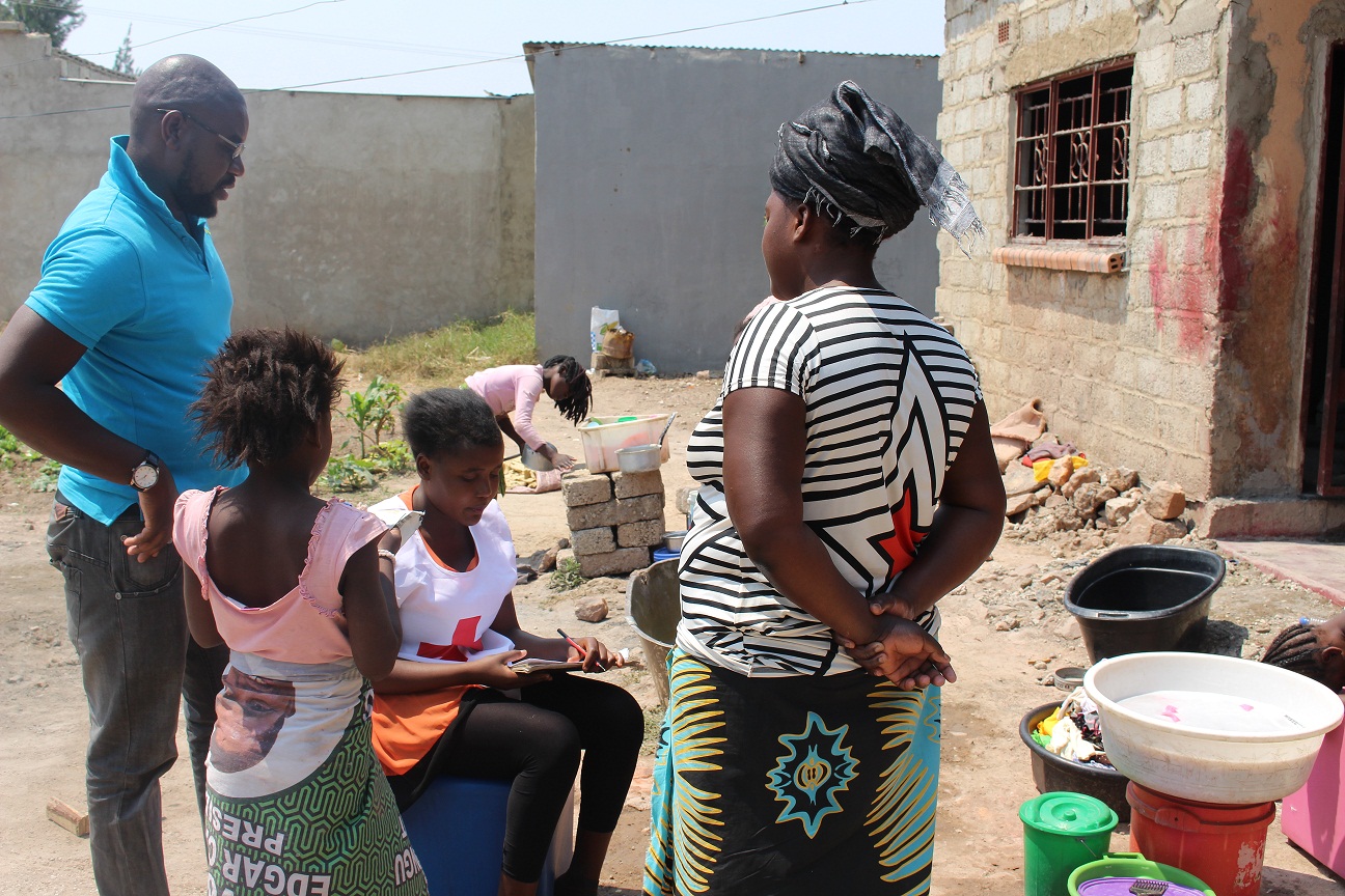 A-Family-in-Chaisa-compound-Listening-to-Messages-for-Measles-and-Rubella-vaccination-by-Zambia-Red-Cross-Volunteers