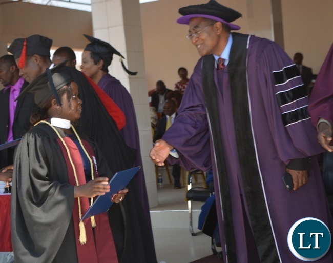 Zambia News and Information Officer (ZANIS) Livingstone Information Officer Angela Mwandu (left) and Rusangu University Vice Chancellor Pardon Mwansa (right) after she received her Bachelor of Arts Degree in Journalism and Communication during the 10th Graduation Ceremony for Rusangu University in Monze Zambia News and Information Officer (ZANIS) Livingstone Information Officer Angela Mwandu (left) and Rusangu University Vice Chancellor Pardon Mwansa (right) after she received her Bachelor of Arts Degree in Journalism and Communication during the 10th Graduation Ceremony for Rusangu University in Monze
