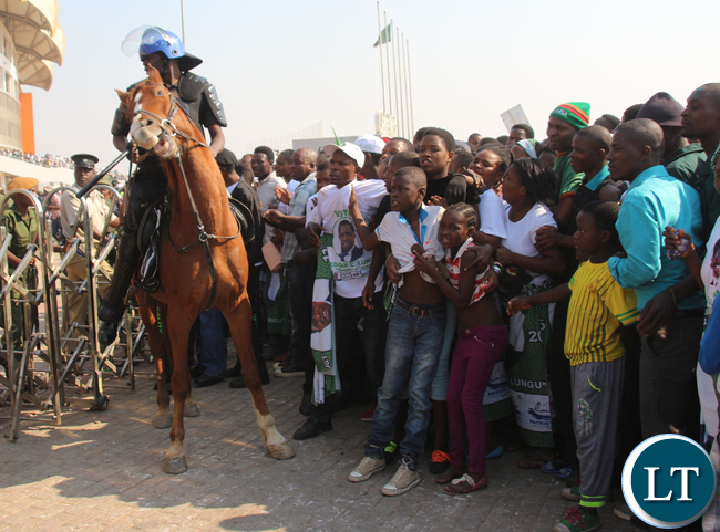 A ZP officer from mounted section trying to control the crowd.
