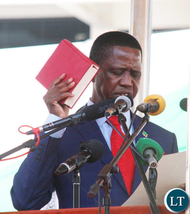 President Edgar Chagwa Lungu Being Sworn by Her ladyship Mrs Irene C Mambili Chief Justice of Zambia at Inaguration ceremony at Heroes Stadium in Lusaka