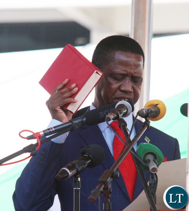 President Edgar Chagwa Lungu Being Sworn by Her ladyship Mrs Irene C Mambili Chief Justice of Zambia at Inaguration ceremony at Heroes Stadium in Lusaka