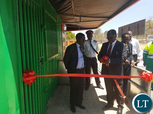 L-R Mr Kaziwe Kaulule, Rev Howard Sikwela and Ms Thecra Milambo before cutting the ribbon