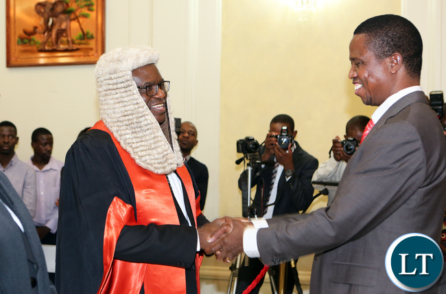 President Edgar Lungu chats with Speaker of the National Assembly Patrick Matibini(right) First Speaker of the National Assembly Catherine Namugala and Newly appointed second Speaker of the National Assembly Mwemba Malama during swearing in Ceremony
