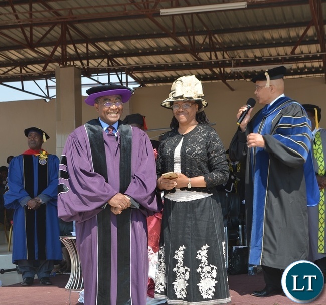 Kenya's University of Africa Vice Chancellor Delbert Baker (far right) introduces Rusangu University Vice Chancellor Pardon Mwansa and his wife (middle) as Rusangu University council chairperson Harrington Akombwa (far left) look on during the 10th Graduation Ceremony for Rusangu University in Monze