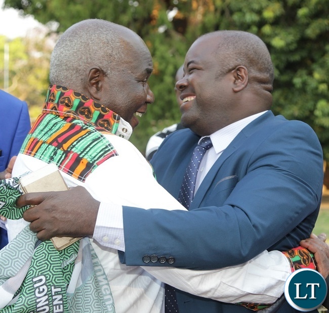 Former Deputy Minister of Works and Supply,Col. Mpanji Kaunda is welcomed by Deputy Minister of Youth and Sports, Ronald Chitotela at the Luncheon State House.