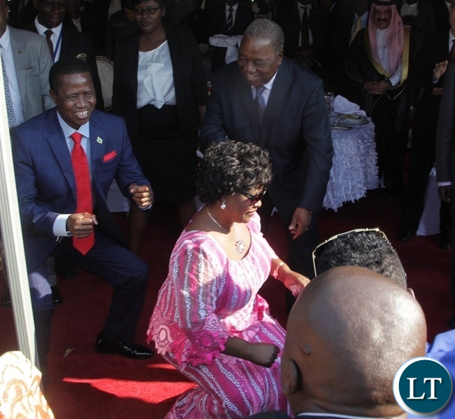 PRESIDENT Edgar Lungu with the First Lady, Esther Lungu doing what they know best during the Luncheon at State House.