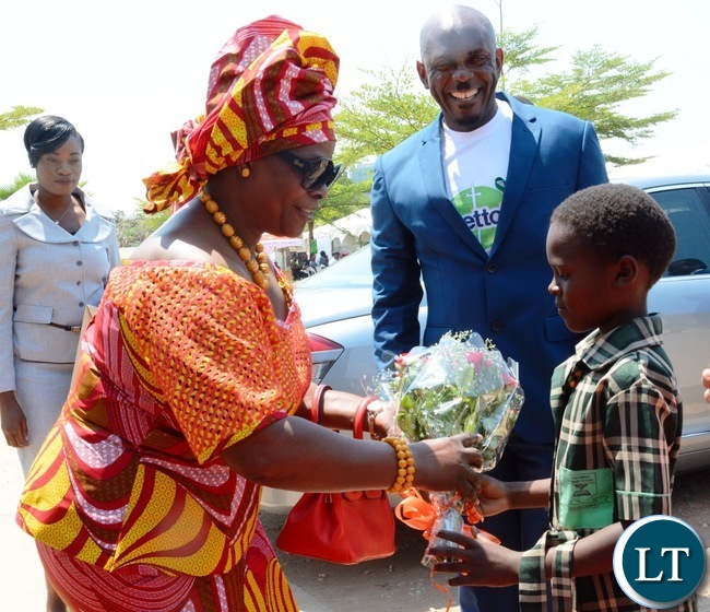 First Lady Esther Lungu(l) being welcomed by a Grade One pupil of North mead Primary School Natasha Namukwanya(r) at Giacomo Global Hand Washing Day at North mead Primary School