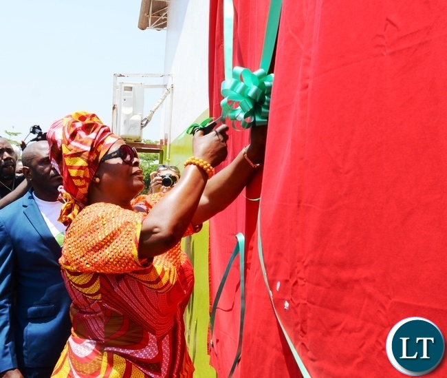 First Lady Esther Lungu cuts the ribbon to officially open the Esther Lungu Administration Block at North mead Primary School during the Giacomo Global Hand Washing Day