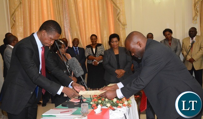President Edgar Lungu(l) swears in Loyd Kaziya as Minister of Water and Sanitation during the Swearing in Ceremony at State House