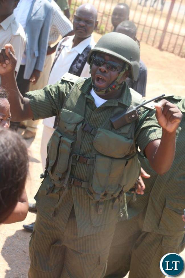 A police officer in riot gear controling the crowd that gathered to see HH and GBM