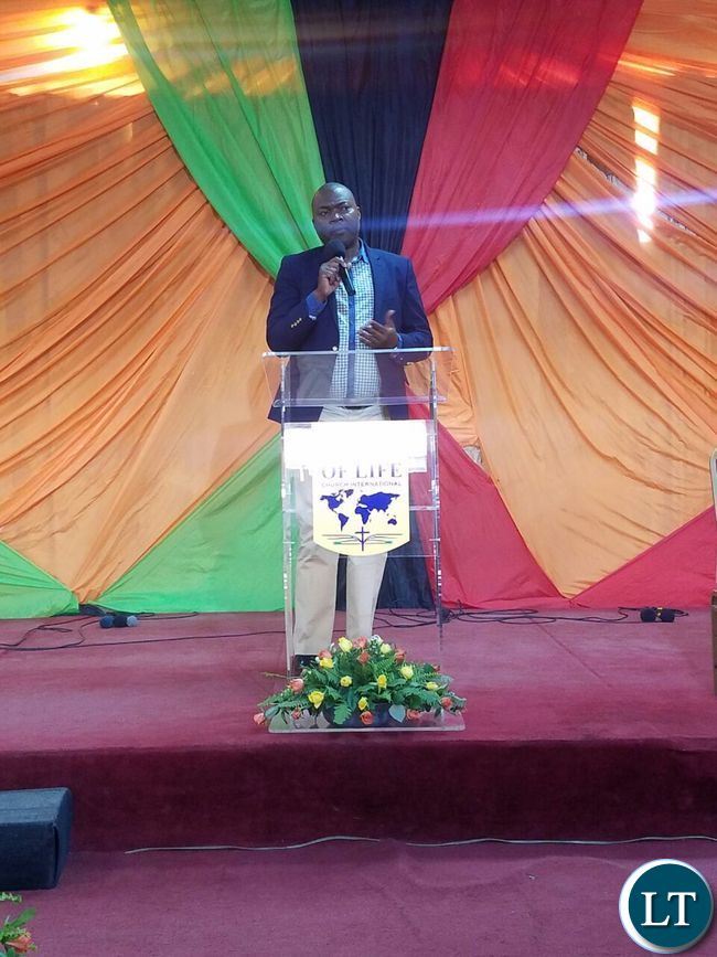 Addressing congregants at Bread of Life Church Ndola Main Branch