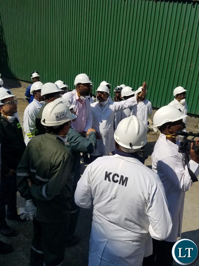 KCM CEO Steven Din stresses a point as he briefs Copperbelt Minister Bowman Lusambo during the tour of the smelter plant
