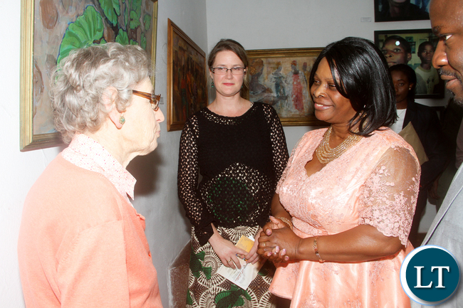 First Lady Esther Lungu speaks with Cynthia Zukas during the official opening of the National Women's Art Exhibition at Henry Tayali Visual Arts center at Show grounds in Lusaka on Tuesday, October 4,2016 -Picture by THOMAS NSAMA