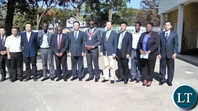Kitwe Mayor Christopher Kangombe and Visting Shunyi District People's Government of Beijing Municipality Senior Advisor Wang Gang posing for a picture with some delegation members during their visit to Kitwe Kitwe Mayor Christopher Kangombe and Visting Shunyi District People's Government of Beijing Municipality Senior Advisor Wang Gang posing for a picture with some delegation members during their visit to Kitwe