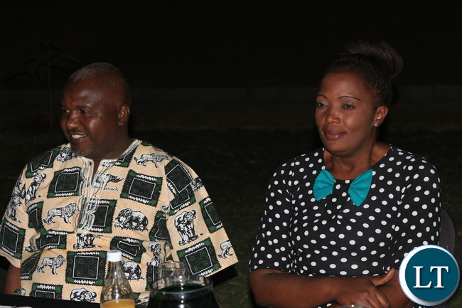 Members of the media interacting over dinner