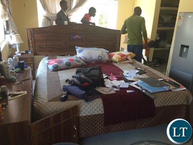 Police officers processing Dr Chishimba's bedroom