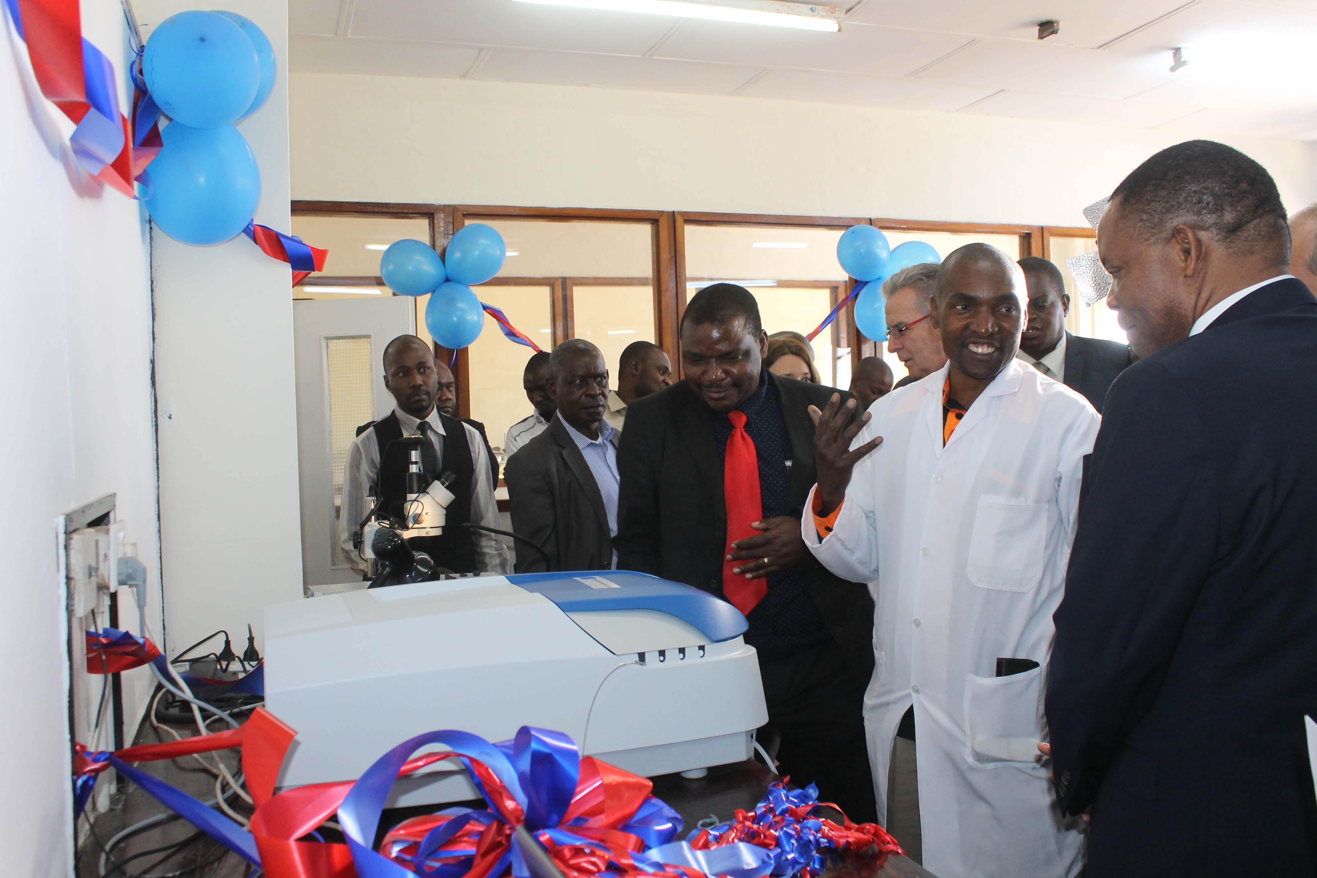Senior Technician Chemistry Mr Gift Mwaula explains the use of the UV Spectrophotometre at the official unveiling of mineral production monitoring equipment at GSD on the 5th of October.