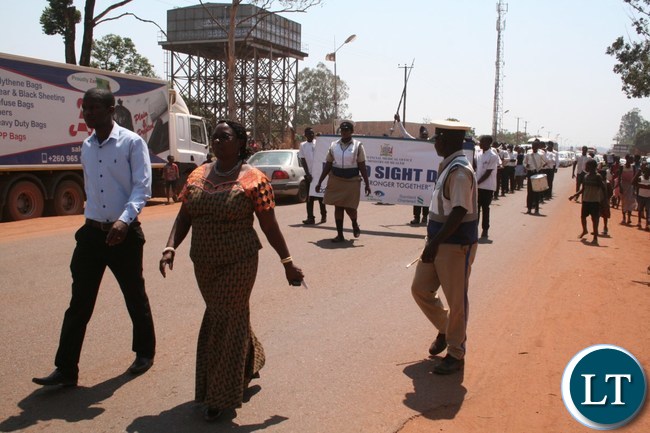 -Solwezi District Commissioner Rosemary Kamalonga (r) with Orbis Provincial Projects Officer Moffat Shawa during the march past to commemorate the World Sight Day at Kyawama grounds whose theme was ‘’Stronger Together” locally known as Kishina, Kyaimena Pa Kyakosa Pamo in Solwezi -Solwezi District Commissioner Rosemary Kamalonga (r) with Orbis Provincial Projects Officer Moffat Shawa during the march past to commemorate the World Sight Day at Kyawama grounds whose theme was ‘’Stronger Together” locally known as Kishina, Kyaimena Pa Kyakosa Pamo in Solwezi