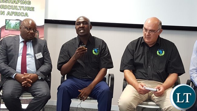 Lusaka Province Minister, Mr. Japhen Mwakalombe (centre) speaking during a panel discussion at the symposium in Pretoria on Wednesday, 19th October, 2016. With him are Agri-Zambia Board Member Mr. Levi Tembo, and AaA Chairperson Dr. Theo De Jager