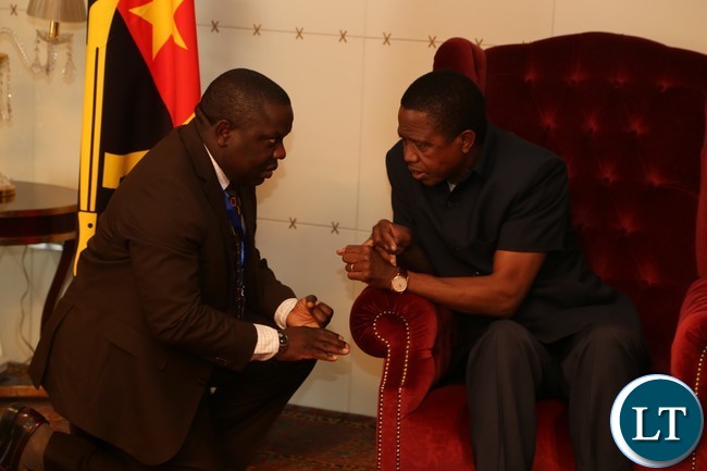 President Lungu talks to minister of foreign affairs Harry Kalaba on arrival at Luanda international Airpot in Angola 26-10-2016