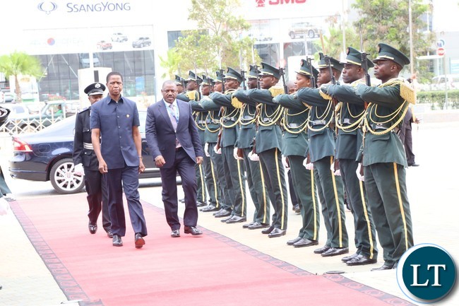 President Lungu flanked by Angolan minister of transport Augusto da silva arrives at the conference centre for the great lakes summit in Luanda 26-10-2016. .