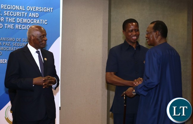 President Lungu confers with Chad President Idriss Deby while Angolan President Eduardo do Santos Looks on during the Great Lakes Summit at vila talatino conference centre in Luanda Angola on 26-10-2016