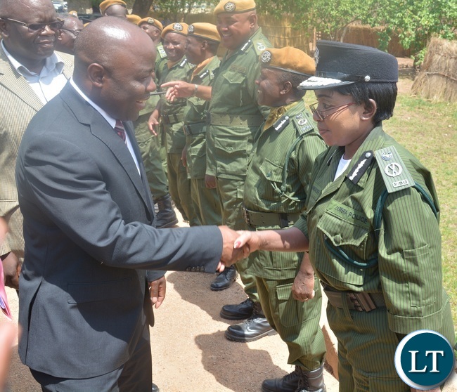 Minister of Home Affairs Stephen Kampyongo shake hands with Central Province Police Commissioner Lombe Kamukoshi shortly after the 2015-2016 Pass out Parade in Geoffrey Mukuma Training School or called Sondela in Kafue District Minister of Home Affairs Stephen Kampyongo shake hands with Central Province Police Commissioner Lombe Kamukoshi shortly after the 2015-2016 Pass out Parade in Geoffrey Mukuma Training School or called Sondela in Kafue District