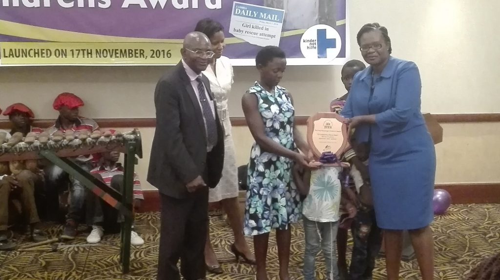 LAZ president Linda Kasonde presenting the Triza Kanyanga childrens award