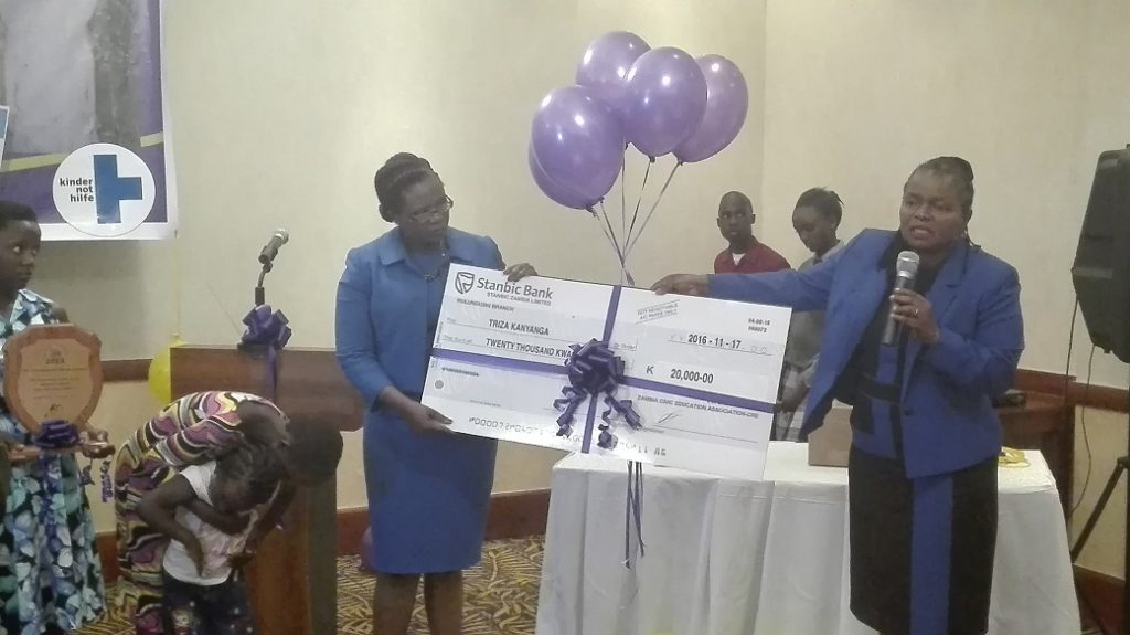 LAZ president Linda kasonde (right) and ZCEA executive director Judith Mulenga presenting the K20000 cheque