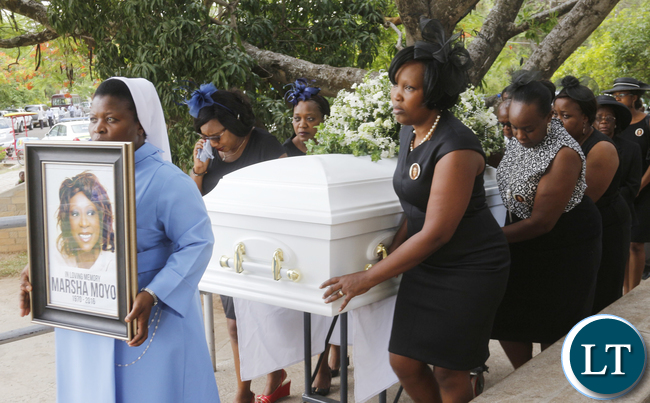 Former Roma Girls pupils as pallbearers of a casket carrying the remains of the late Masha Moyo prior to the memorial service; the ceremony took place at the Lusaka Holy Cross Cathedral